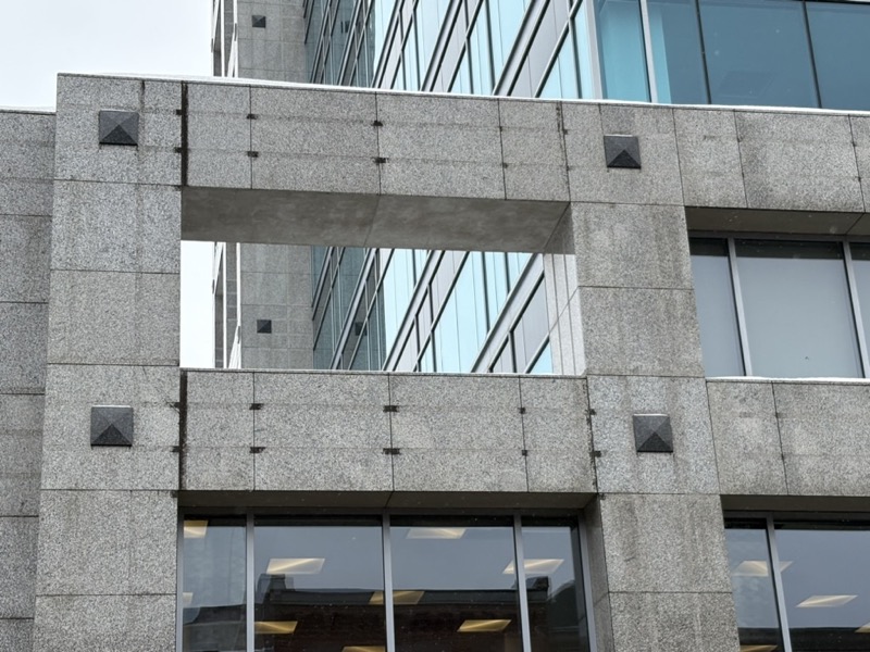 Close-up architectural detail of the marble frame of the building