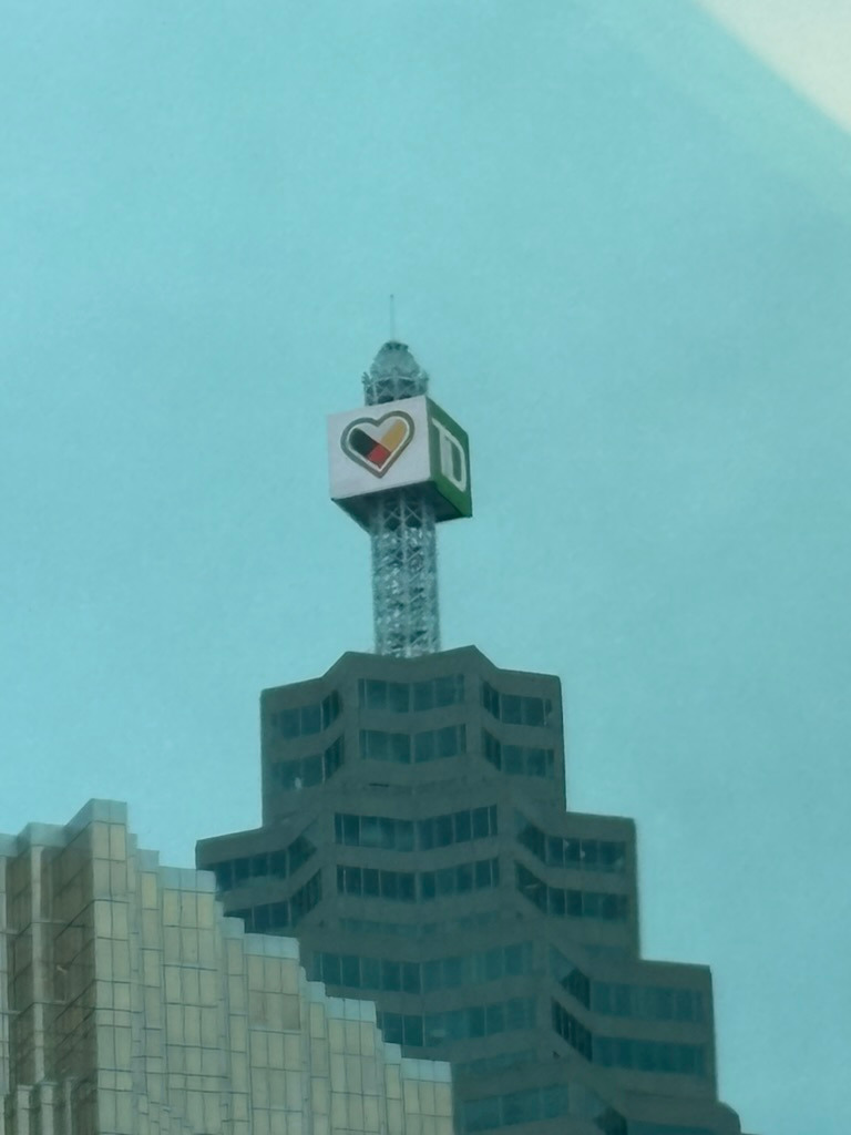 Photo of the top of TD skyscraper in Toronto, sporting a medicine wheel in the shape of a heart.